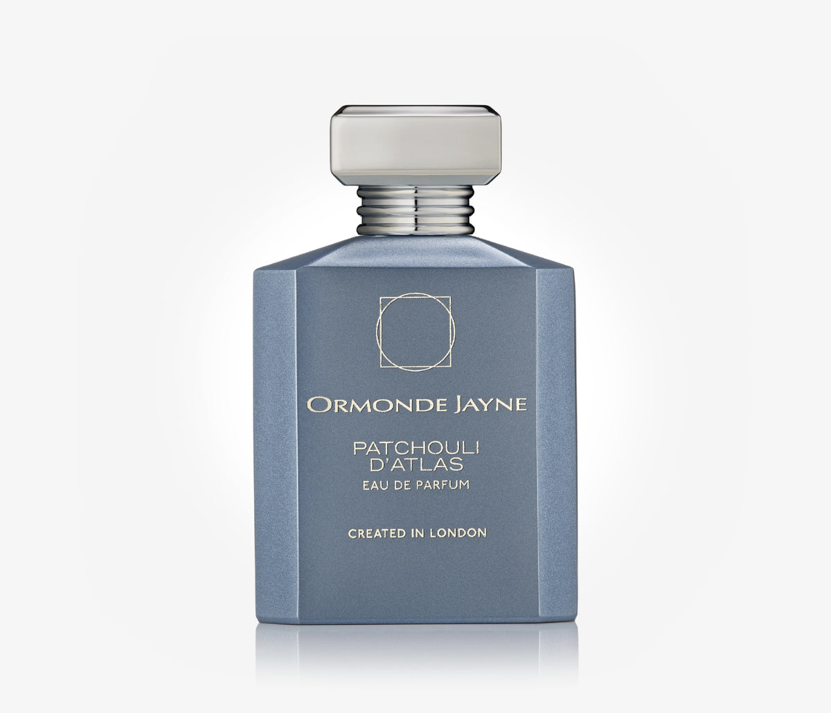 A bottle of niche perfume Patchouli D'Atlas by Ormonde Jayne on a pale grey background.