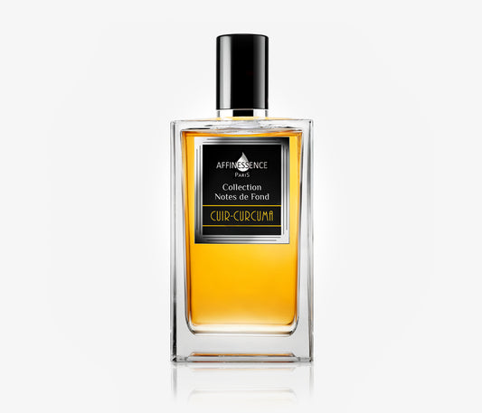 A bottle of the luxury niche Affinessence Cuir-Curcuma perfume on a pale grey background.