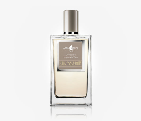 A bottle of Affinessence Gingembre-Latte a luxury niche fragrance on a pale grey background.