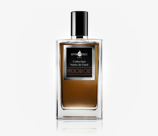 A bottle of Affinessence Patchouli-Oud niche luxury fragrance on a pale grey background.