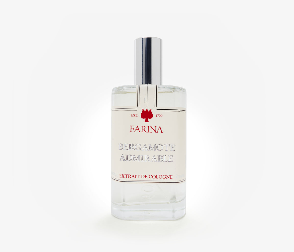 A bottle of the luxury perfume Bergamote Admirable by Farina 1709 set against a pale background.