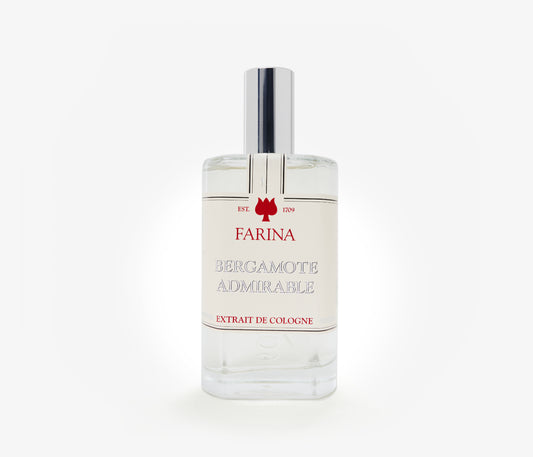 A bottle of the luxury perfume Bergamote Admirable by Farina 1709 set against a pale background.