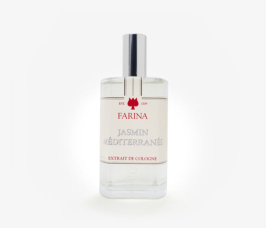 A bottle of the luxury perfume Jasmin Méditerranée by Farina 1709 set against a pale background.