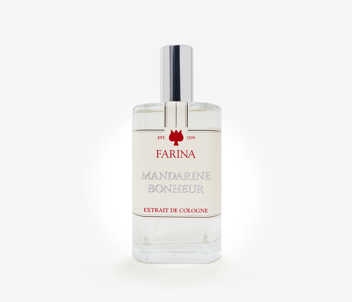 A bottle of the luxury perfume Mandarine Bonheur by Farina 1709 set against a pale background.