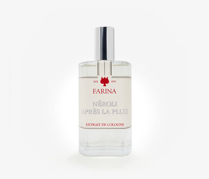 A bottle of the luxury perfume Néroli Àpres la Pluie by Farina 1709 set against a pale background.