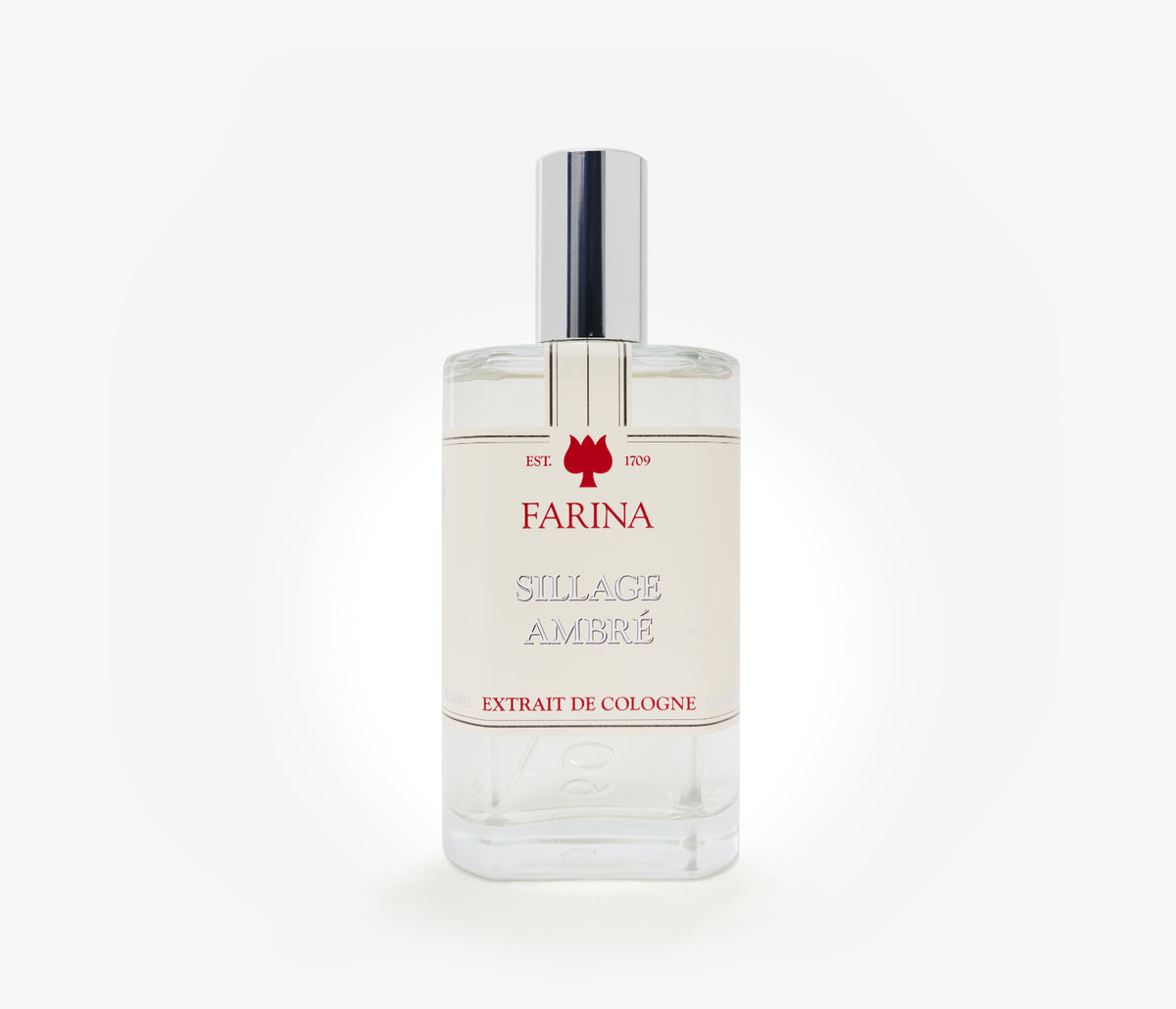A bottle of the luxury perfume Sillage Ambre by Farina 1709 set against a pale background.