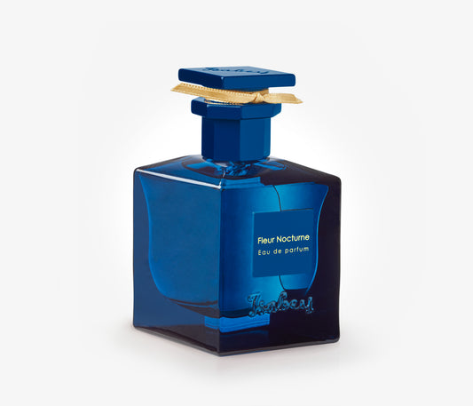 A bottle of Isabey Fleur Nocturne exclusive luxury perfume on a pale grey backgound.