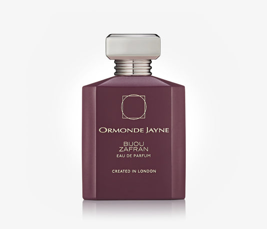A bottle of niche perfume Bijou Zafran by Ormonde Jayne on a pale grey blackground.