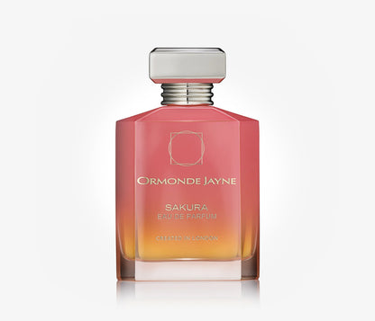 A bottle of niche perfume Sakura by Ormonde Jayne on a pale grey background.