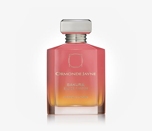 A bottle of niche perfume Sakura by Ormonde Jayne on a pale grey background.