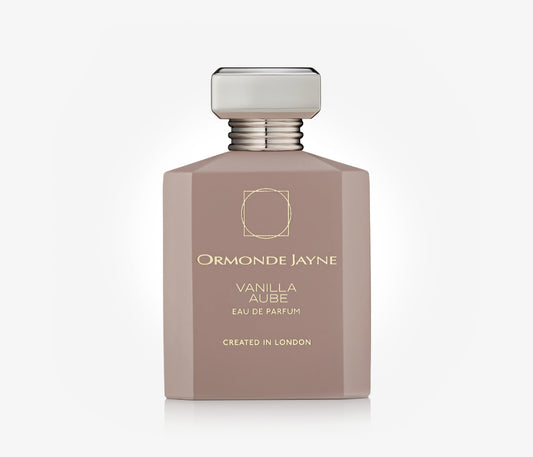 A bottle of the niche perfume Vanilla Aube by Ormonde Jayne on a pale grey background.
