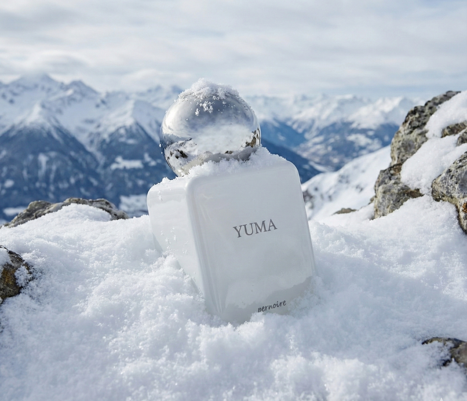 Yuma product in the snow with mountains in the background