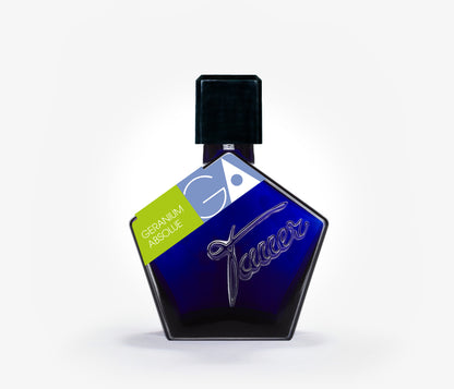 A bottle of the niche perfume Tauer Geranium Absolue on a pale grey background