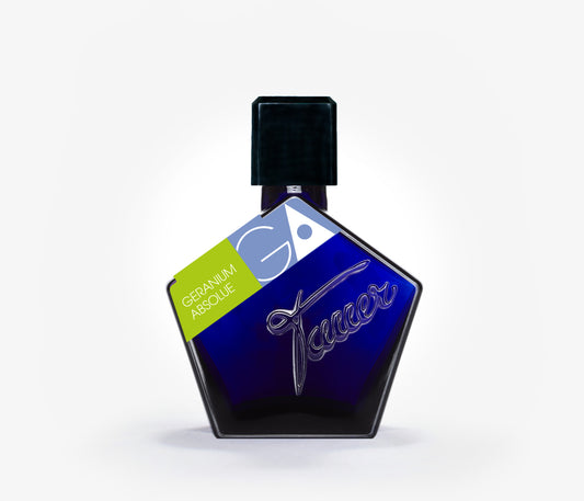 A bottle of the niche perfume Tauer Geranium Absolue on a pale grey background